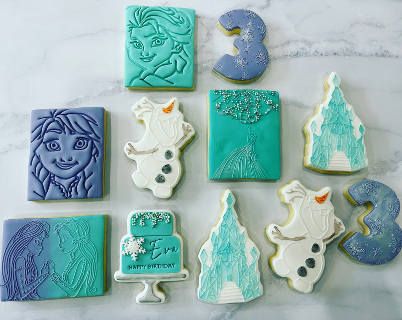 Frozen Cookies with white olaf, Blue Elsa, Light Blue Anna and ice castle cookies