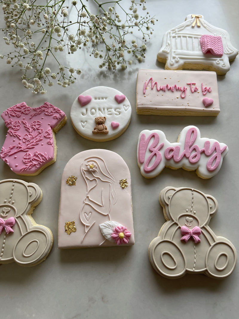 White Girl Baby Cookie with Pregnant Mother and Brown Bear Cookie.  Mummy to be cookie and white circle baby name cookie