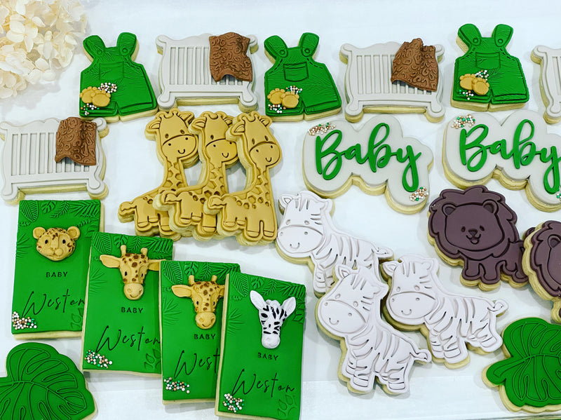 Green Baby Shower Cookies with Jungle Theme with Giraffe Cookie, Zebra Cookie and Lion Cookie.