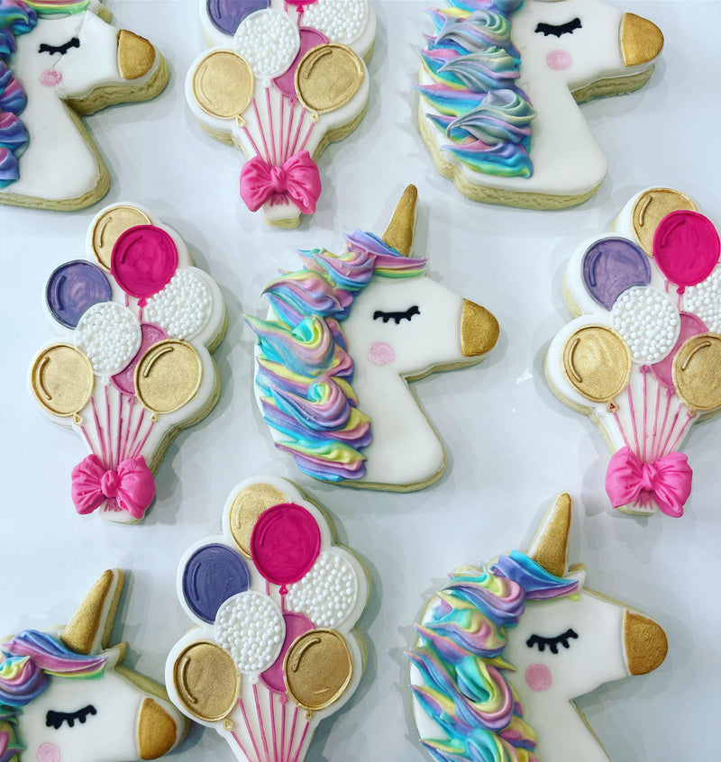 White Unicorn with a Gold Horn and Nose, and Rainbow Balloon Luxury Decorative Cookies on a white background.